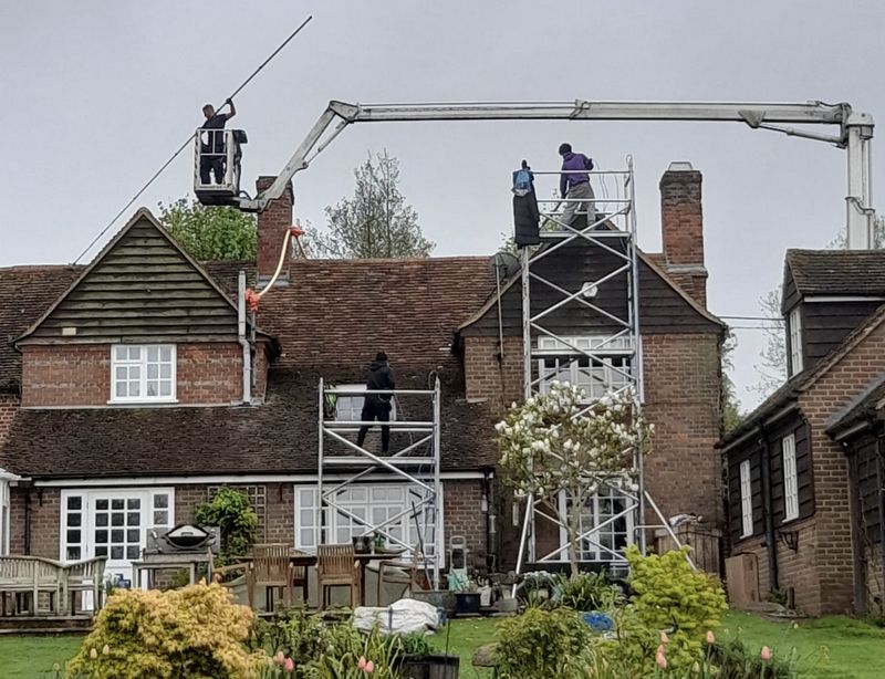 The Roof Moss Cleaners using cherry picker and scaffolding to clean roof safely and professionally in Locks Heath, Hampshire