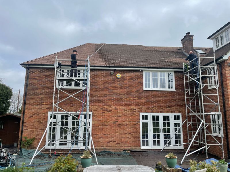 Roof cleaning carried out safely from scaffold towers by The Roof Moss Cleaners in Locks Heath